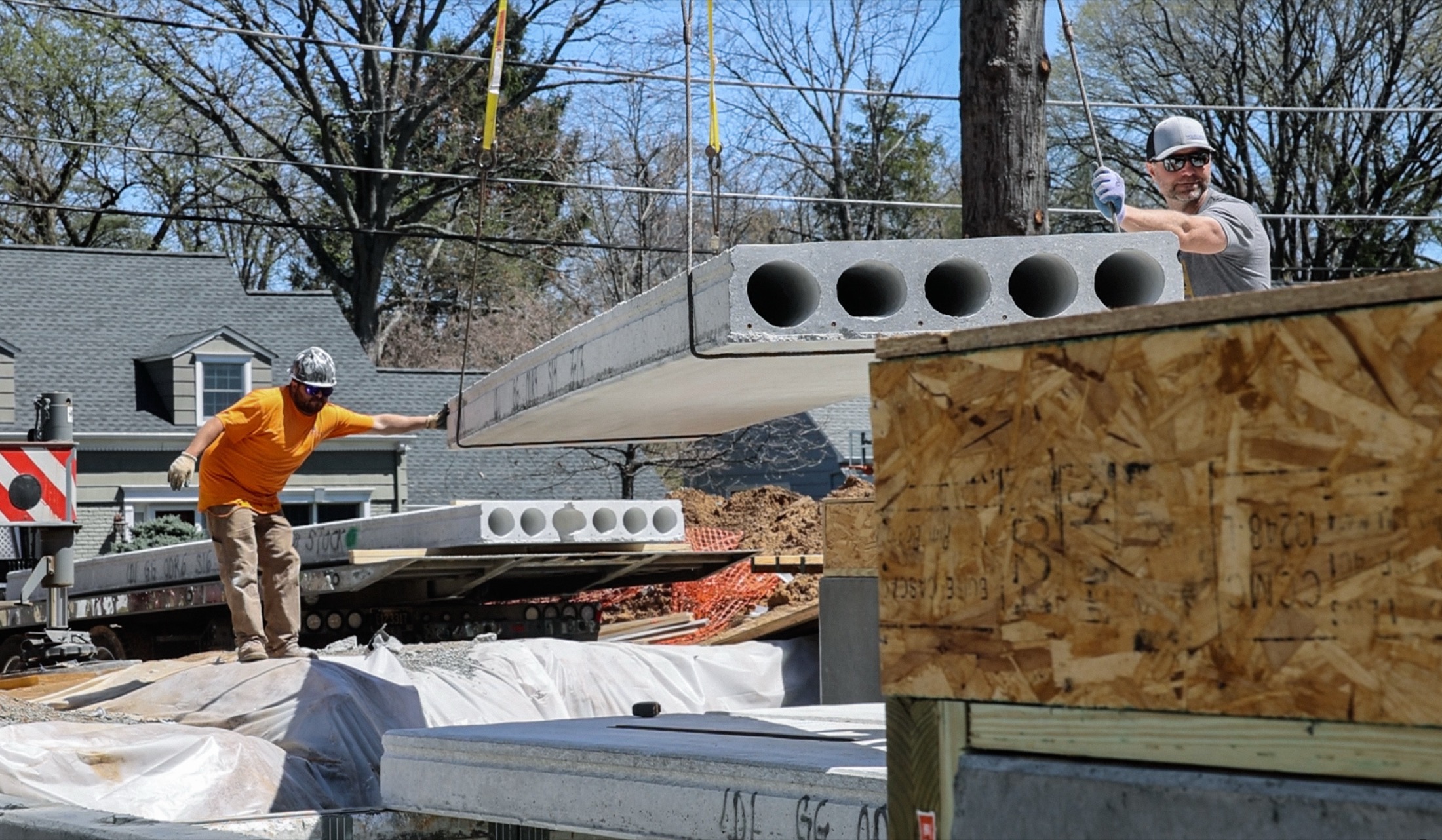 Construction crew installing structural floor planks in Morris County NJ