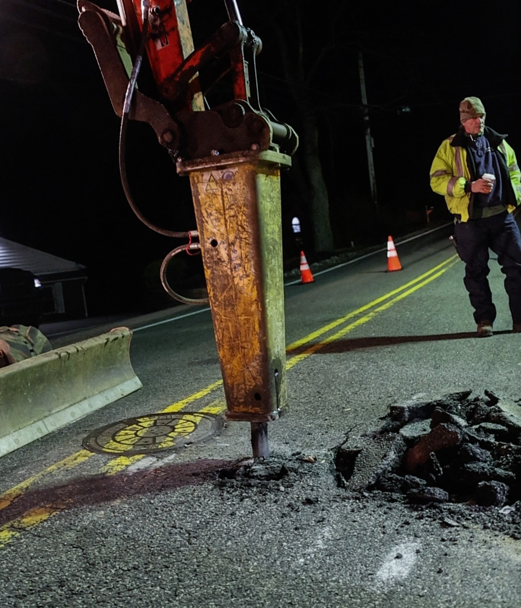 Hydraulic breaker breaking asphalt