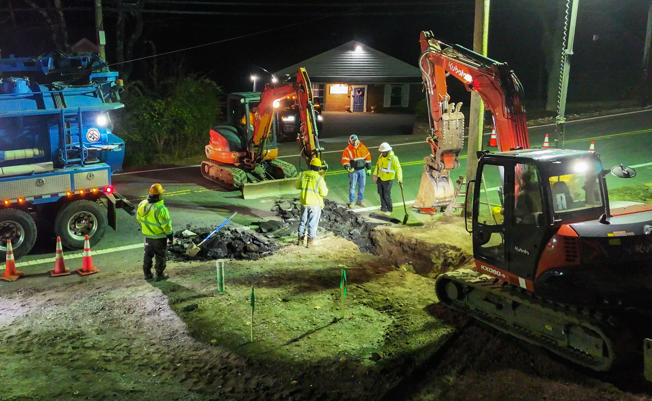 Night crew working road excavation