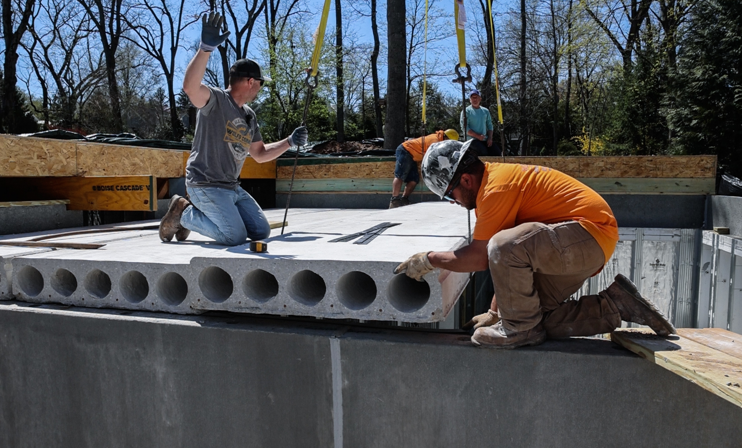 Crew placing precast concrete panels